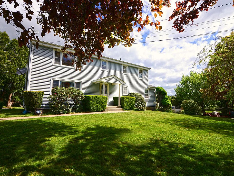 Front of 2-Family Home, Parking on the left.