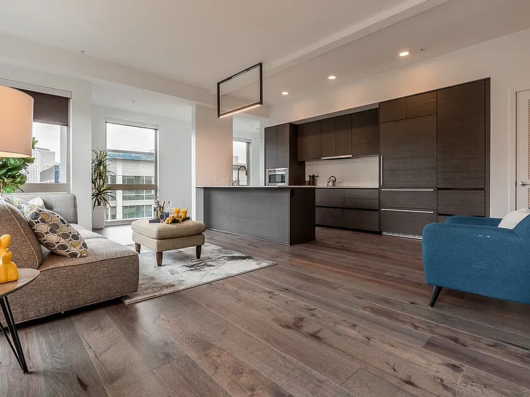 Apartment Kitchen with Wood Cabinets and Lounge Area