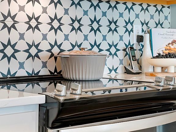The kitchen stovetop of the Lennox townhomes.