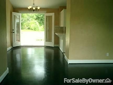 Ebony stained wood floors and tile throughout. High ceilings