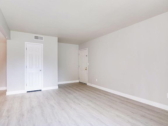 New flooring and paint throughout. Lots of storage: 4 closets inside of unit.