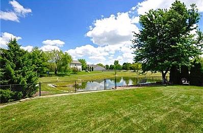 it is unusual to find this large yard with fenced in privacy and a pond view!