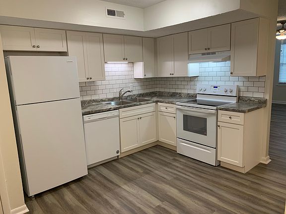Fully renovated kitchen. New cabinets, countertops, and appliances.