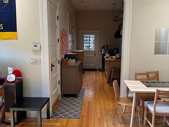 View from entrance door. Dining Room on right, Living room on left, and Kitchen and bed/bath to the left.