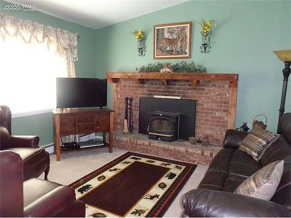 Cozy Family Room with Wood Fireplace.