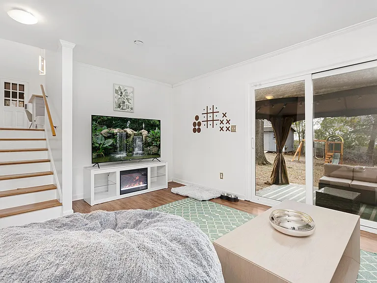 Lounge living space with 65 in TV and electric fireplace