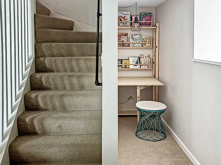 Stairs to lower level, reading/work nook