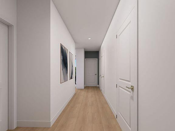 Entry Way Leading to the Open Gathering Room, Dining, and Kitchen