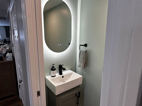 1st floor half bath with a pocket door