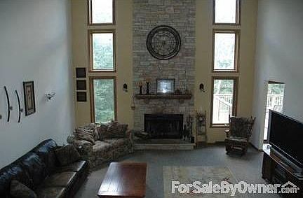 two story great room : wood burning fireplace with available gas line ready