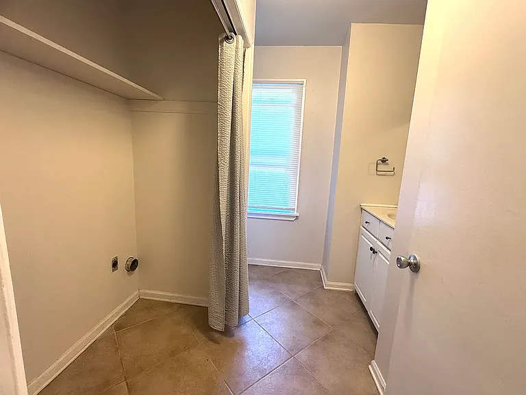 Laundry room with half bathroom