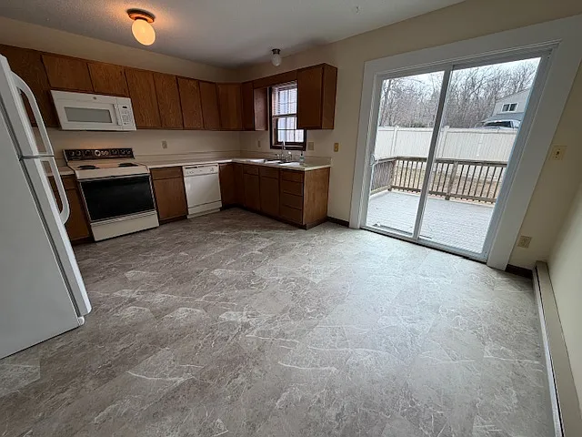 Kitchen from entry towards the nice deck!