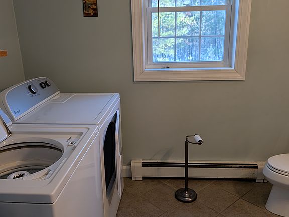 Downstairs half bath with laundry and closet
