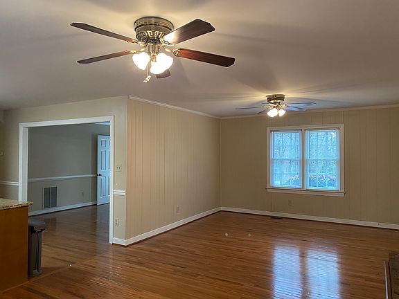 Den looking into dining room and kitchen.
