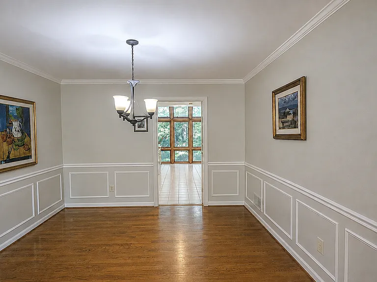 Dining room conveniently connected with sliding doors to kitchen and family room for everyday use.