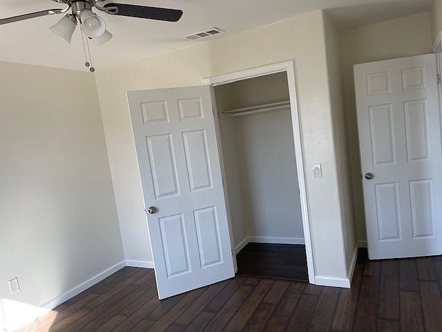 Bedroom #2 with fan and walk in closet