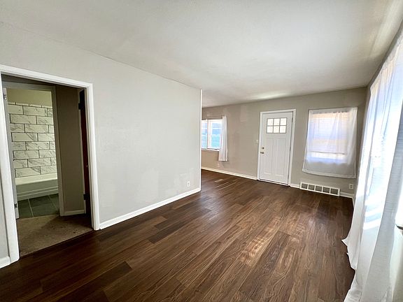 005_Living room with entrance to bathroom with new flooring.