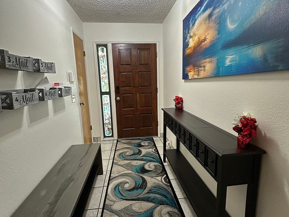 Back is to the living room to the left is the dinning/kitchen/Laundry room