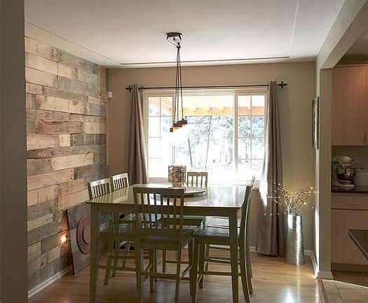 Dining room with amazing wood accent wall