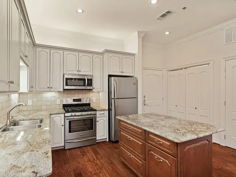 A1 Floorplan - Chef-style kitchen with gas stove & prep island.