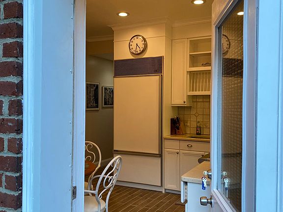 At doorway to Apt 1