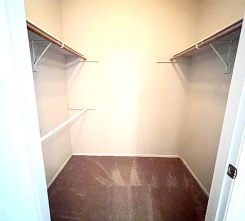 Spacious walk-in closet in master bedroom.
