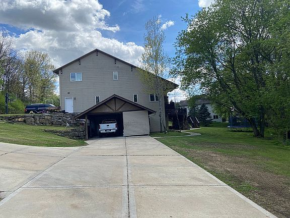 Carport + 4 car gar inside