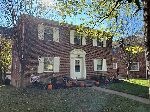 Well manicured building on residential street off the square