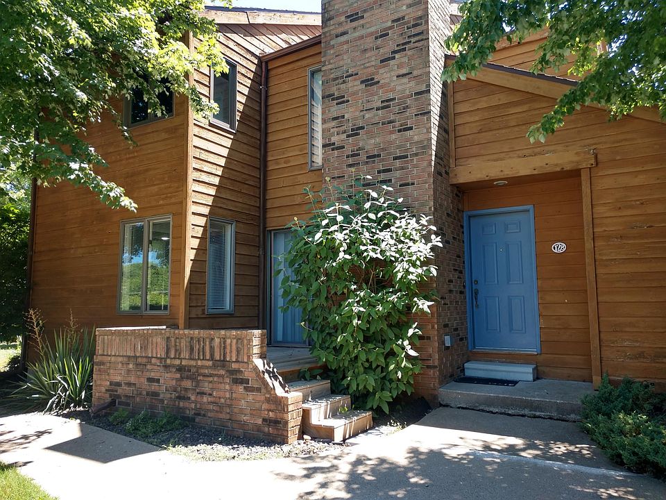 Front Entrance on Delaware St., with Adjacent Patio Accessible from Living Room.