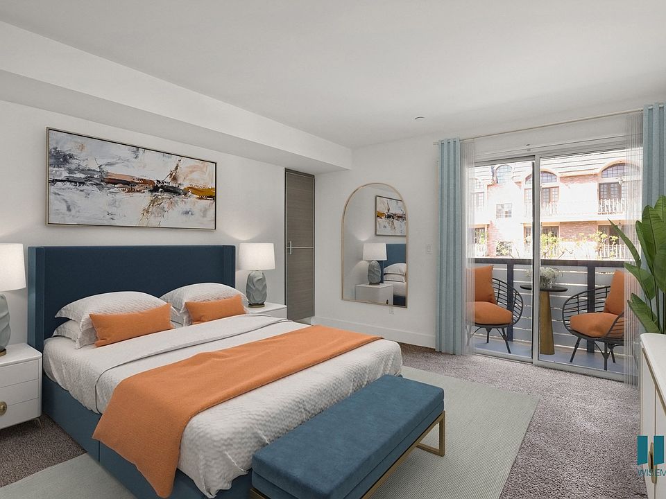 Bedroom with Built-In Storage Cabinets and Patio