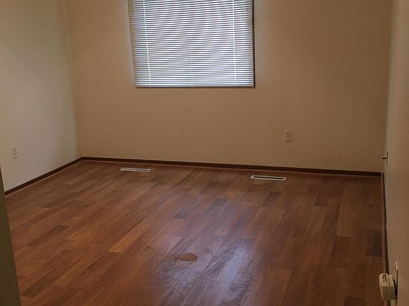 Larger of the two bedrooms with walk in closet.