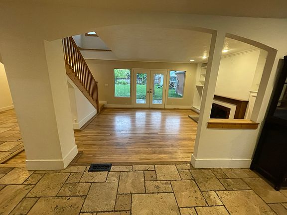 View from the front door / main entry. Kitchen to the left, additional sitting to the right past the stairs