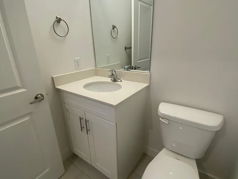 Bathroom #2: Half bathroom from 2nd floor with single vanity (sink and toilet)