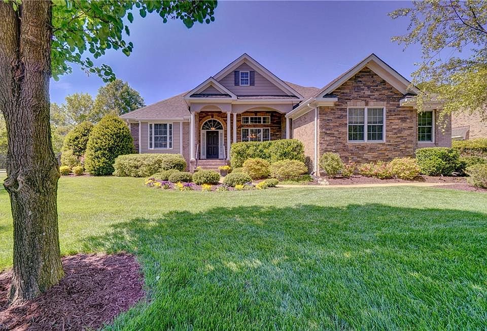 Transitional flair with brick and stone accents