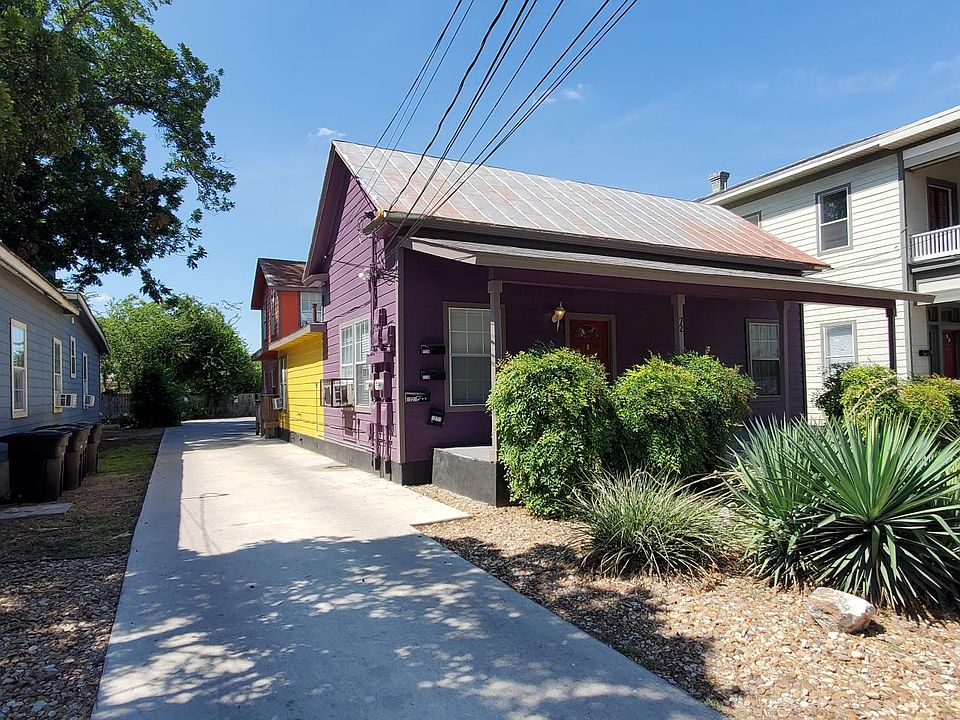 This is the front view of the 4-plex showing driveway to the back