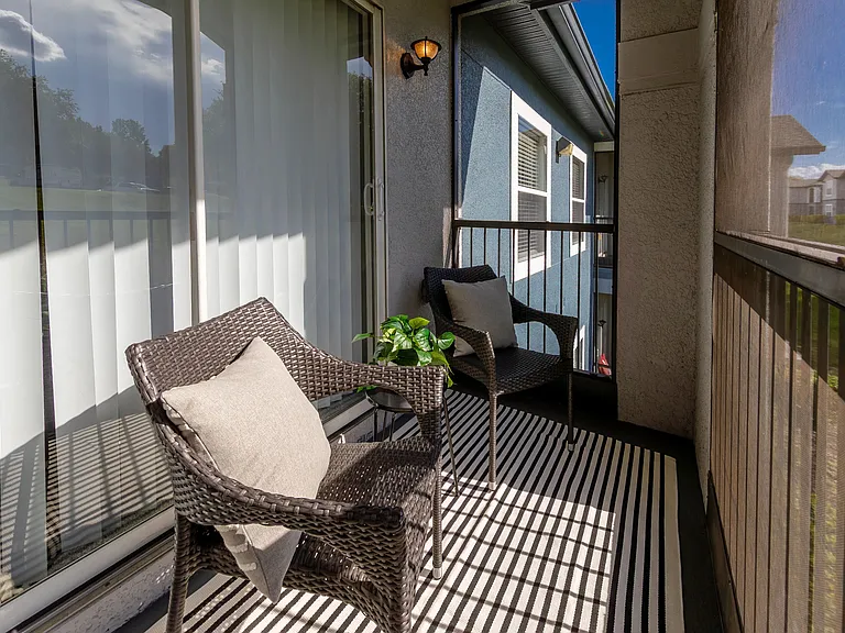 Enjoy a breath of fresh air on your own screened-in deckperfect for morning coffee, evening reads, or unwinding with a view of the community.