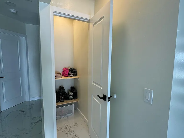 Shoe and jacket closet by main entrance