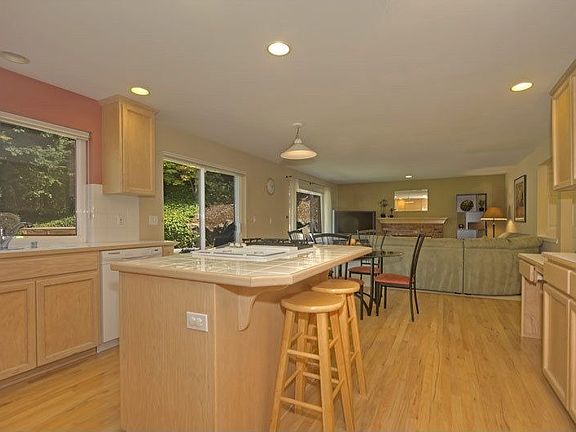 Light filled kitchen & great room look out onto greenbelt.