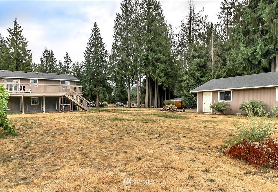 Huge lot, tons of fruit trees and over-sized detached garage.