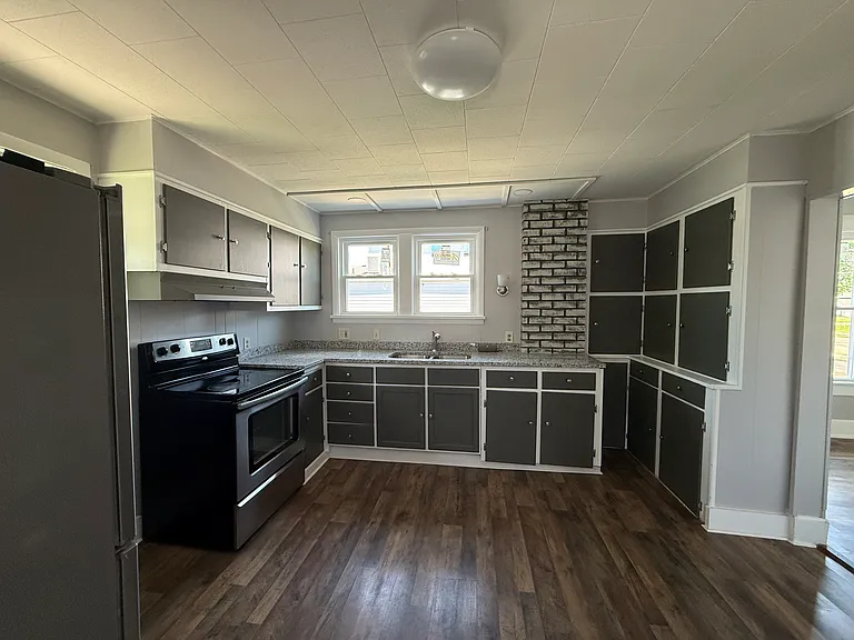 Updates include new granite counters, new sink freshly painted.