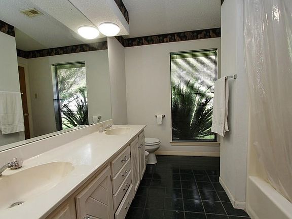 This is the Full Bath with an elongated vanity with dual sinks.
