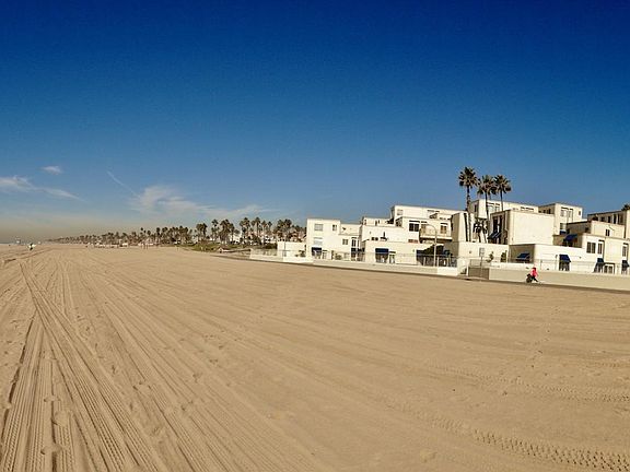 Steps from the sand. The only complex in HB on the sand.