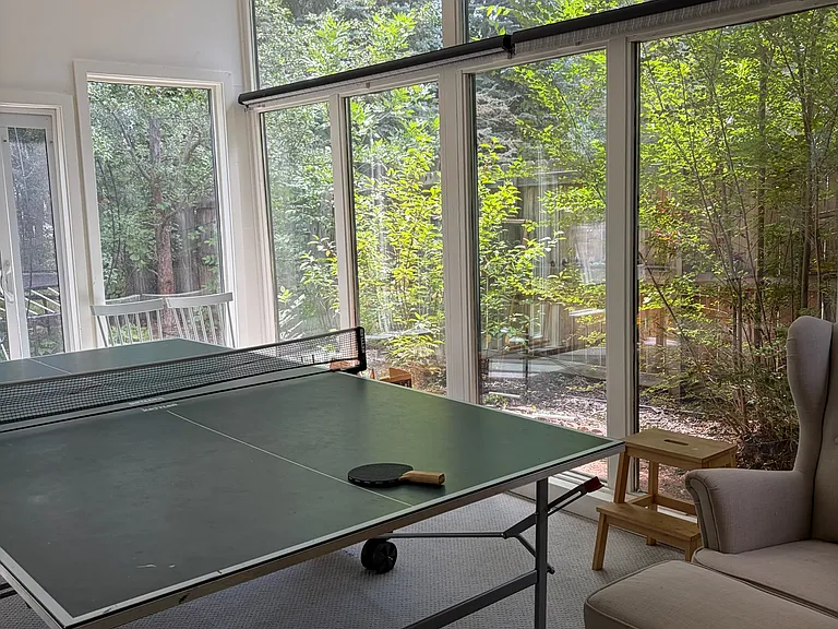 Sunroom with sliding glass door to the private backyard