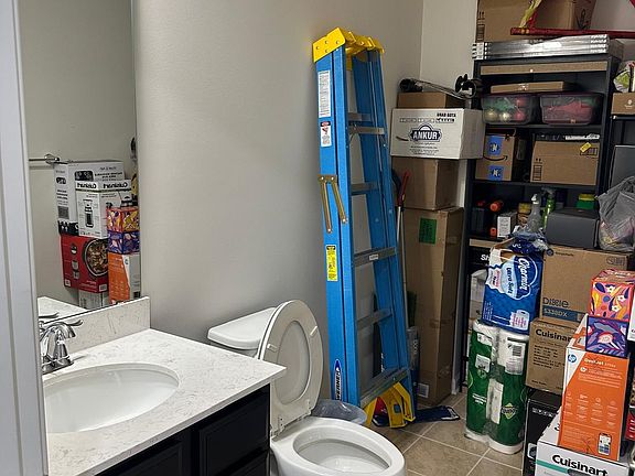 Half Bathroom + Storage - First Floor