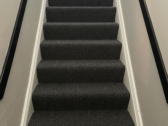 Entry Stairway from outdoor covered front porch to floor 2