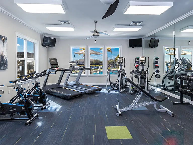 Stay active in our fully equipped fitness center, featuring cardio machines, free weights, and pool views.