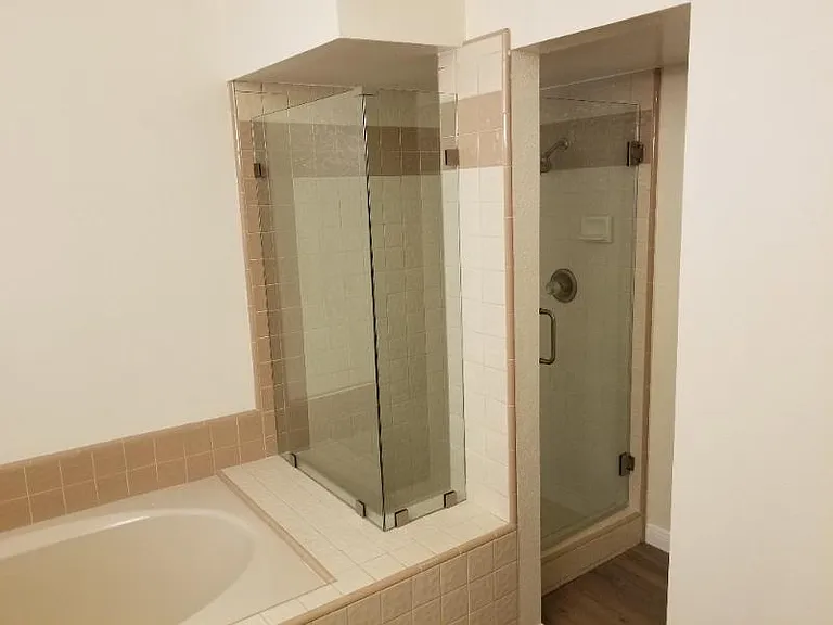 Master bedroom stand alone tub and shower.