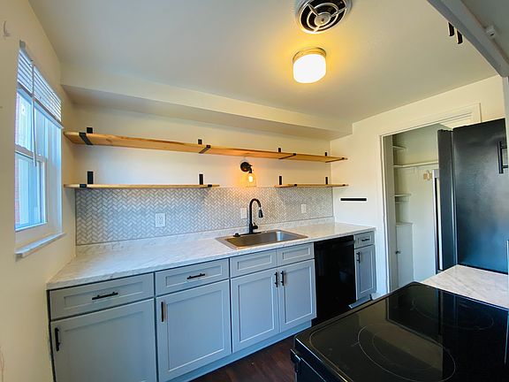 Remodeled kitchen with all new appliances (including dishwasher, large sink, custom tile backsplash, and nice cabinets.