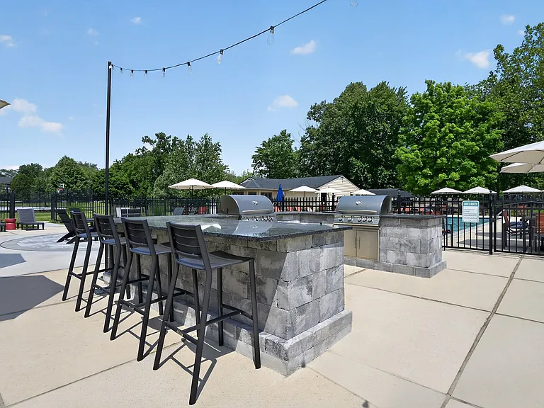 Elevate your lifestyle at Eagle Rock Apartments at Mohegan Lake with our stunning outdoor bar area. Perfect for entertaining or relaxing under the sun, this space invites you to unwind. Schedule your tour today and see it for yourself!