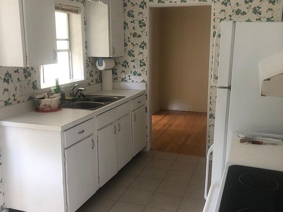 Kitchen, overlooking sunporch and backyard.
